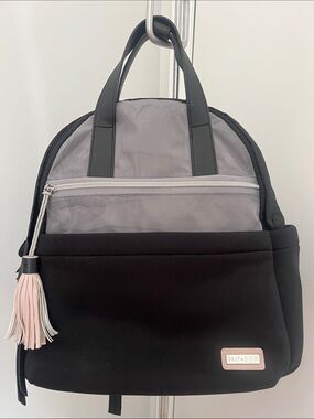 Skip Hop Black and Light Gray Convertible Backpack Tote with Pink Tassel
